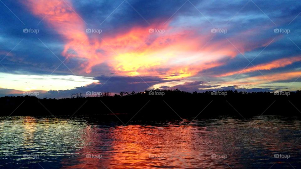 sunrises sunsets foap mission cloud looks like pegasus on fire in the set over salt marsh