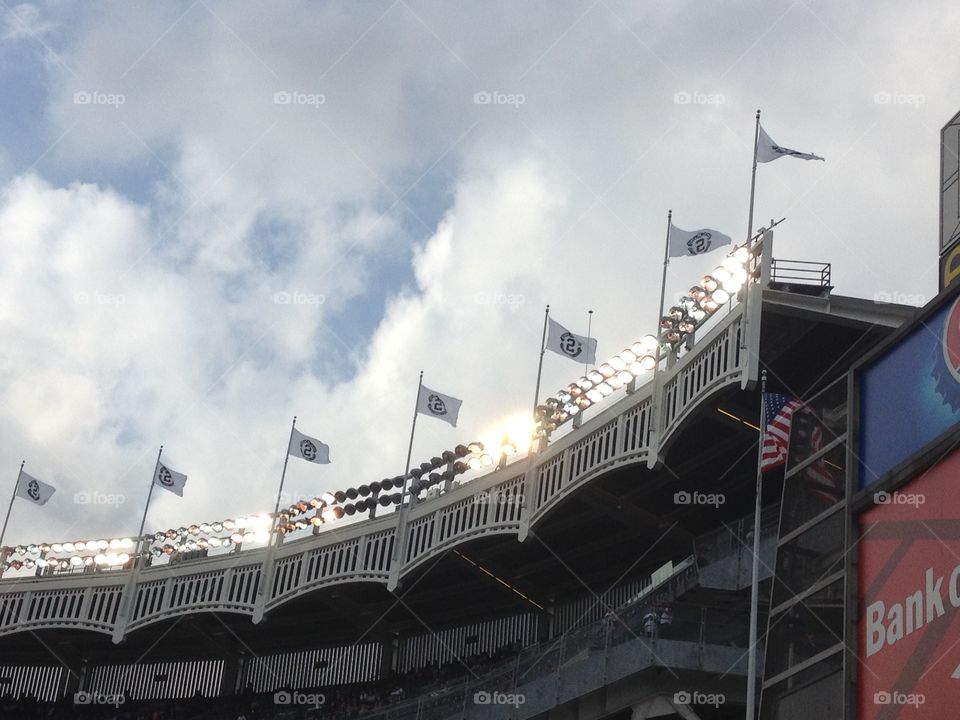 Yankee stadium flying the number 2 flags for Derek Jeter in his final season