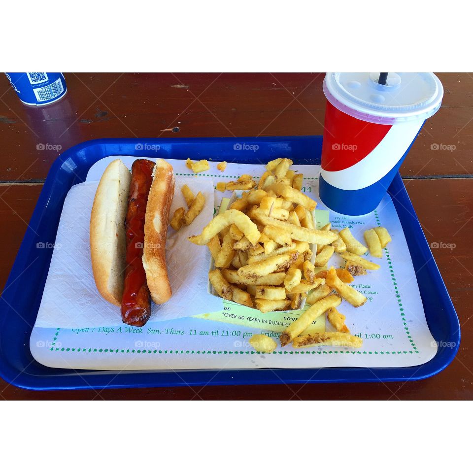An All-America Meal. Eating a classic hot dog and fries from Connors Hot Dog Stand in Angola, New York. 