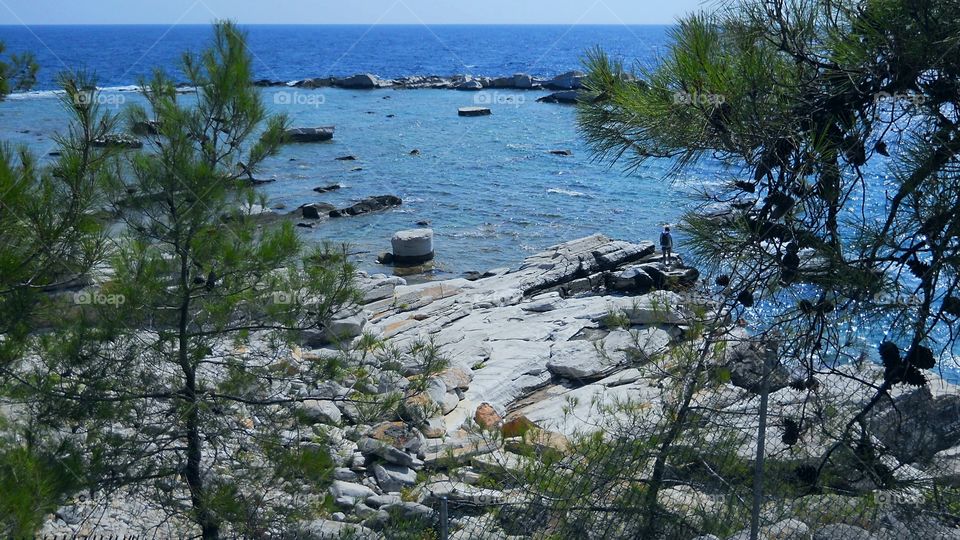 Beautiful view to the combination of stone, wood and sea
