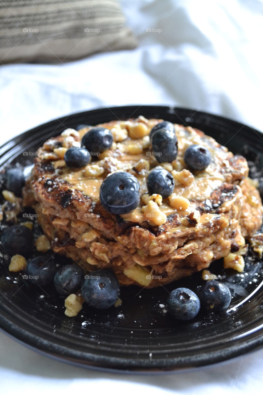 Peanut butter banana pancakes topped with walnuts & blueberries!