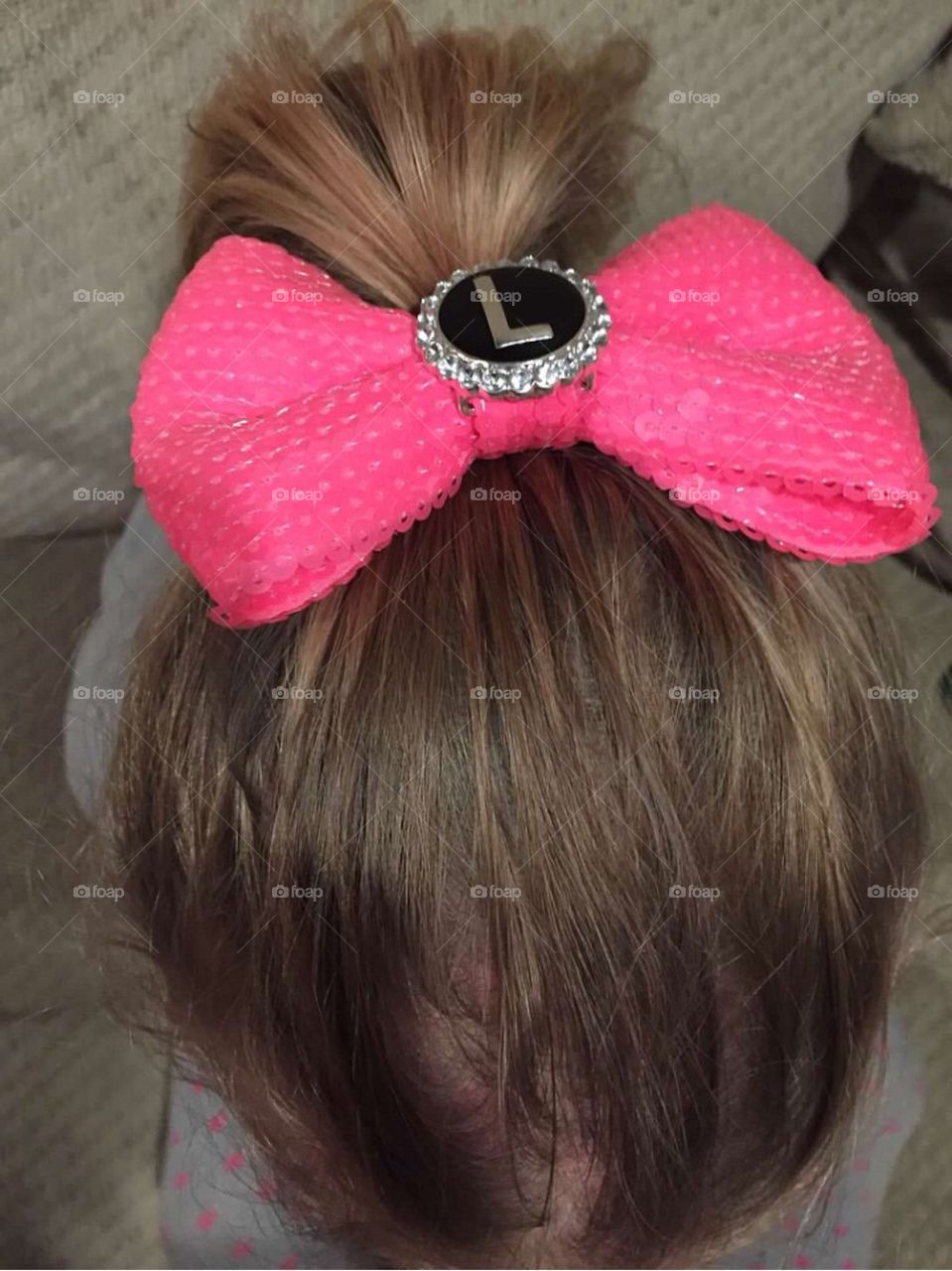 Bright pink hair bow. 