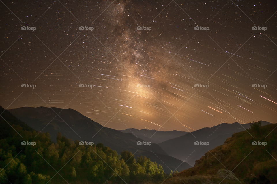 Milky Way twist. Stars Milky Way mountains night long exposure