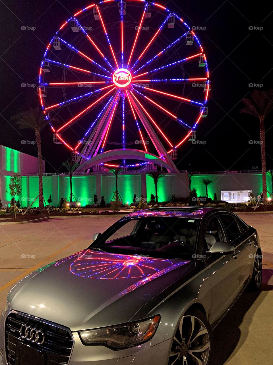 
Cars with soul - 2014 Audi A6 4dr Sdn quattro 3.0L TDI Premium Plus with a reflection from a colorful Ferris Wheel 