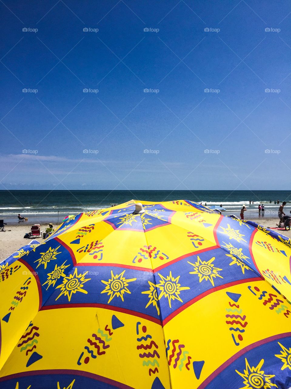 Beach umbrella. Summer day at the beach