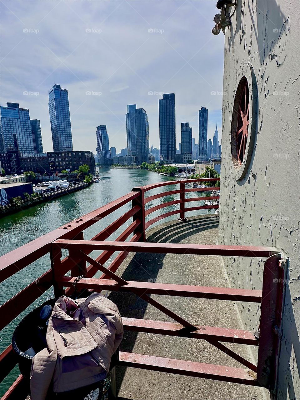 This is beautiful “Newtown Creek” seen from the center outpost of the “Pulaski Bridge” that connects “Greenpoint”, Bklyn to LIC, Queens. Across the “East River” in the distance we can see “Manhattan”. 2024. Hypnotic Productions