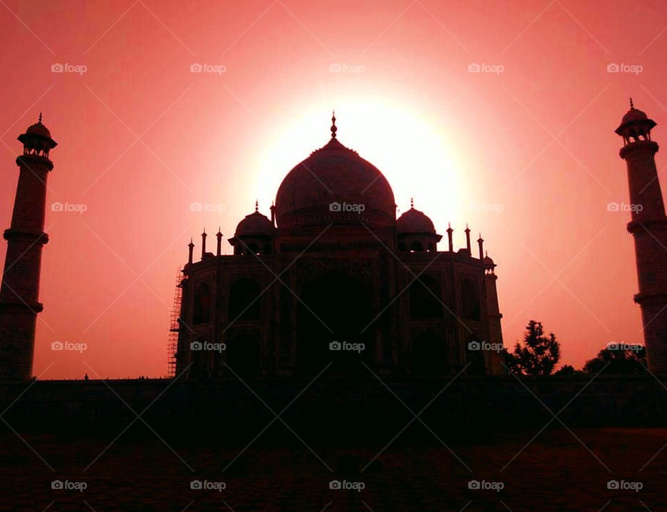 Sunset Silhouette Of A Grand Taj Mahal.