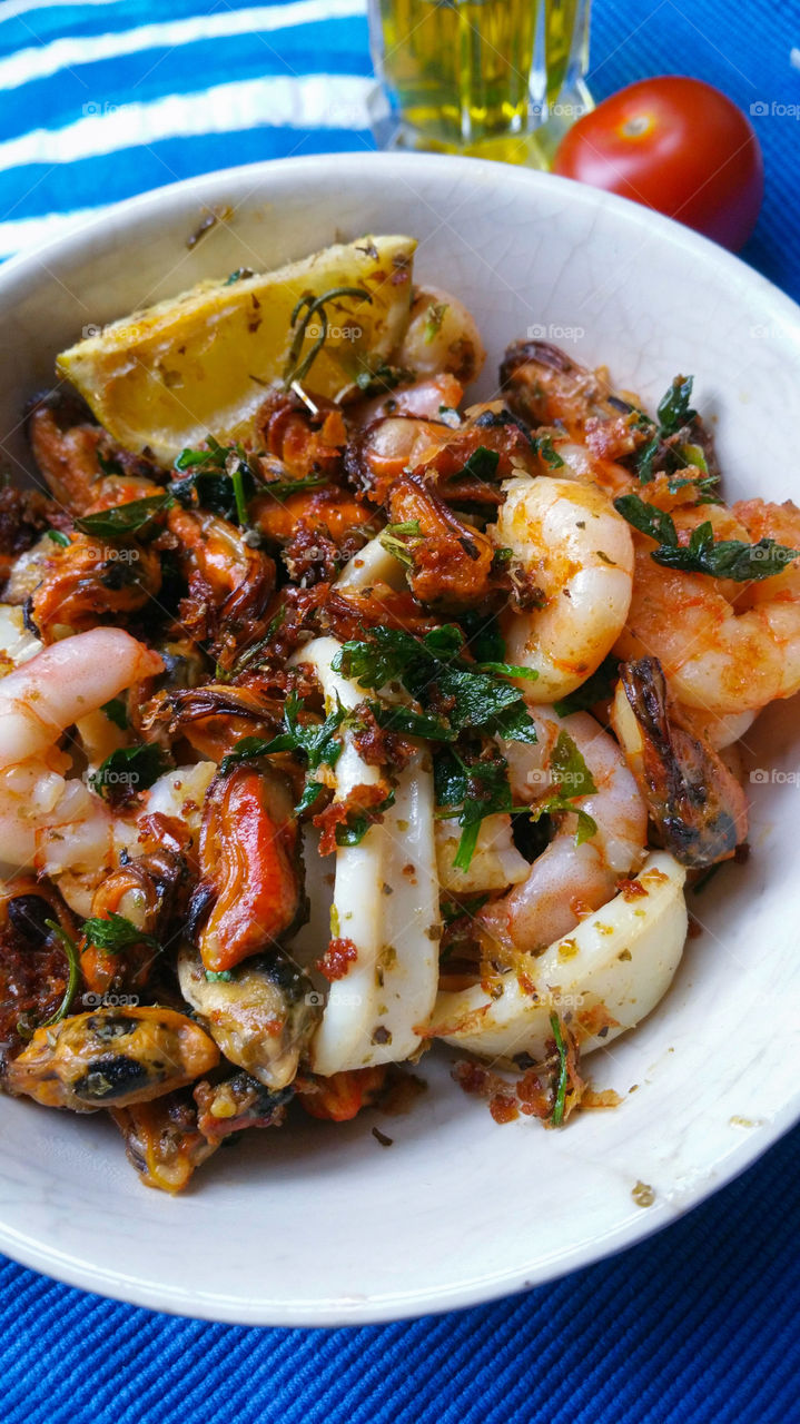 Calamari and other seafood with lemon and parsley