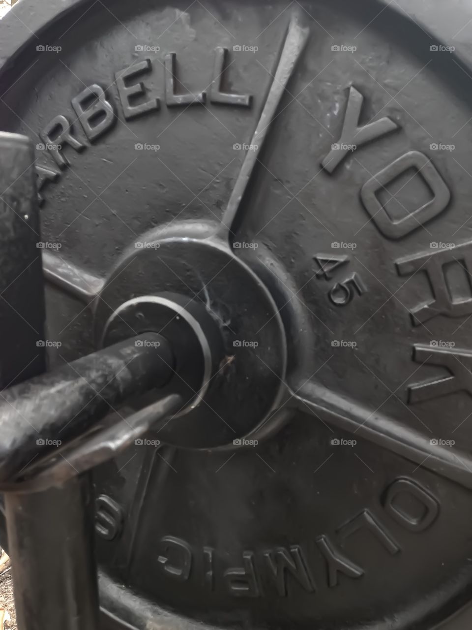 Closeup of an Olympic standard barbell weight. 