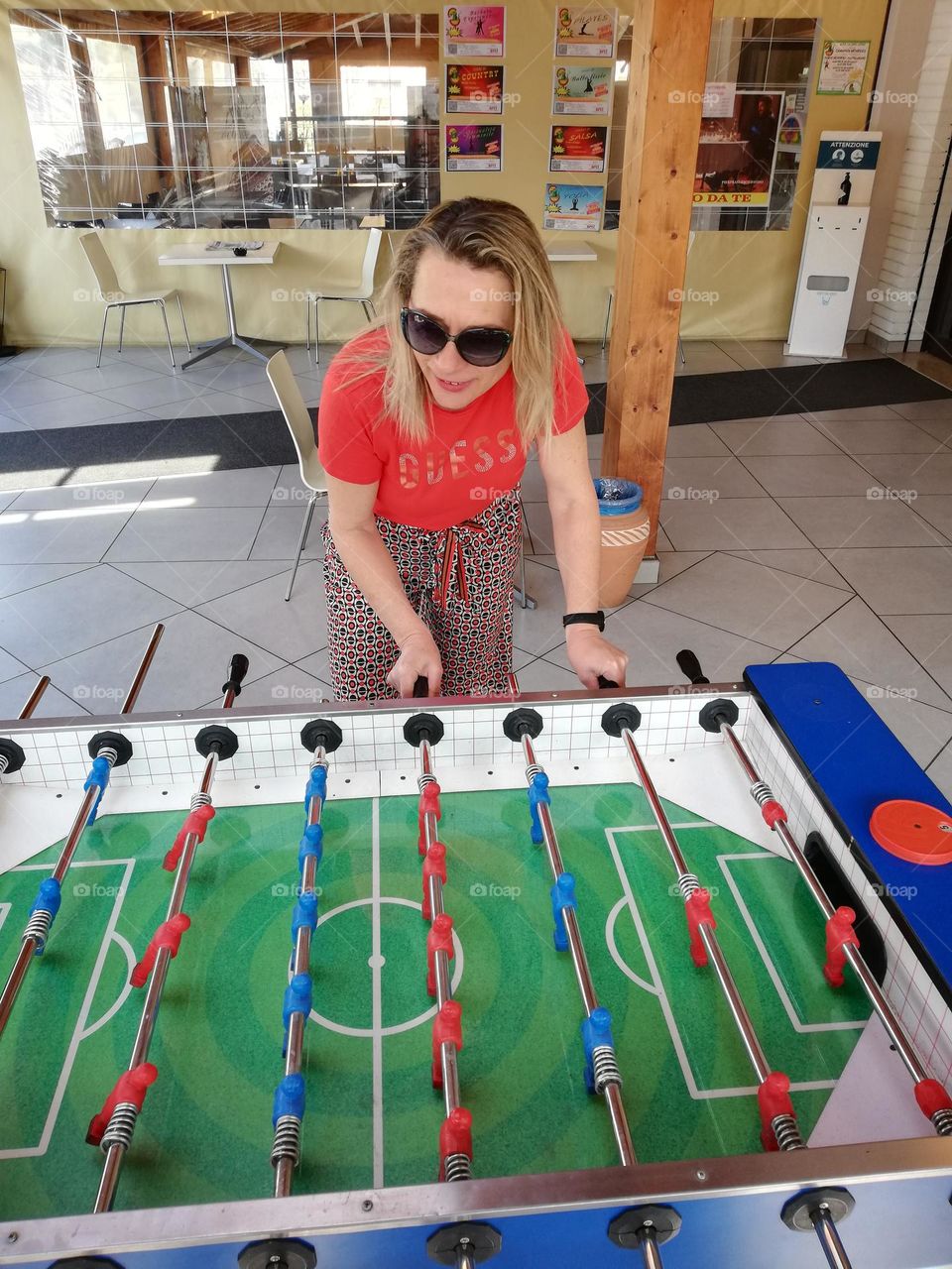 a woman plays table football