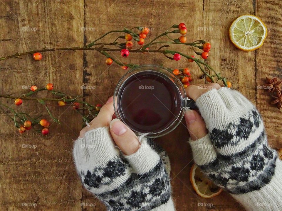 Holding a cup of tea