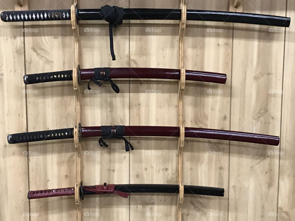 An array of samurai katana and wakizashi. There is nothing like having these handsome blades in the dojo. They are used for training purposes.
