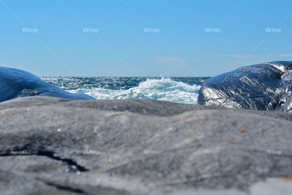 Bubbling sea with cliffs