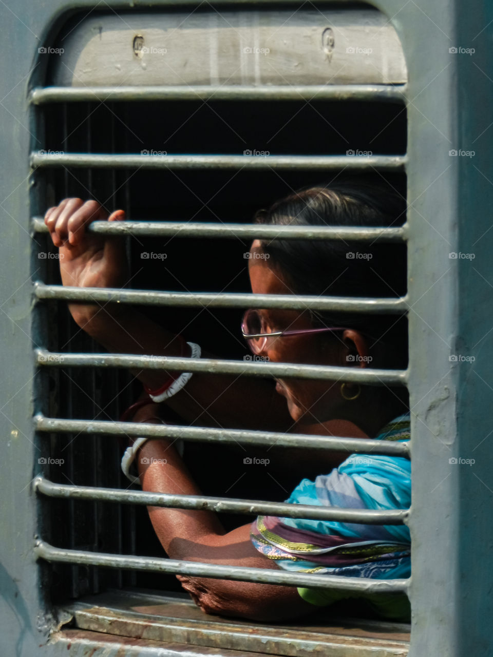 a passenger through Indian rail window