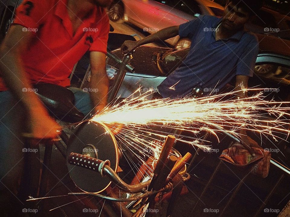 man with cycle knives sharpening
for food earning through this job