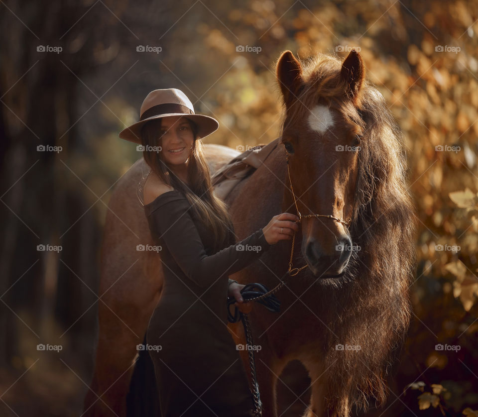 Portrait of young woman  with tinker horse 