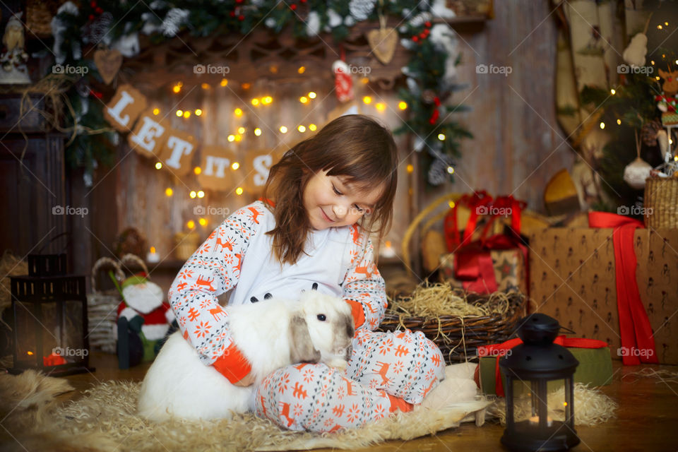Little girl with Rabbit at Christmas Eve 