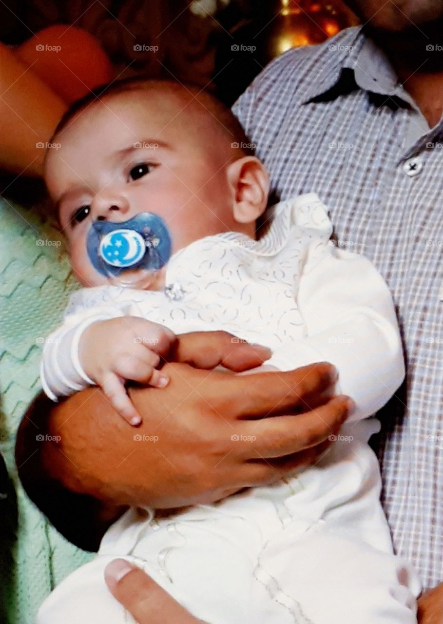 Infant,breast_child with a child in his arms