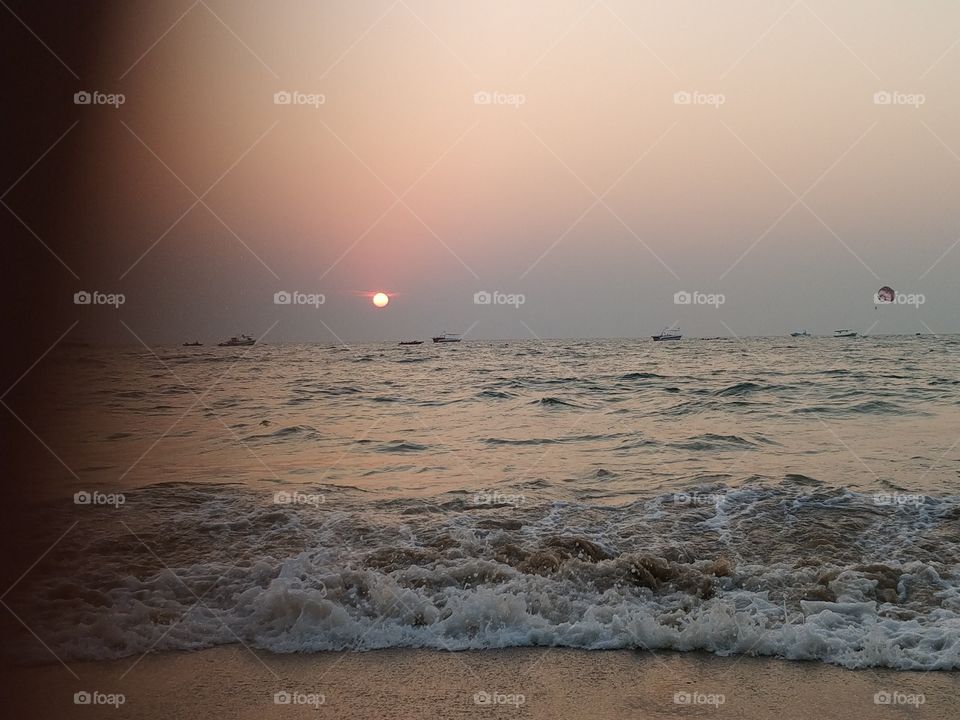 awesome sunset at the time of dawn. nothing beautiful than nature. sea, waves, sunset, dawn