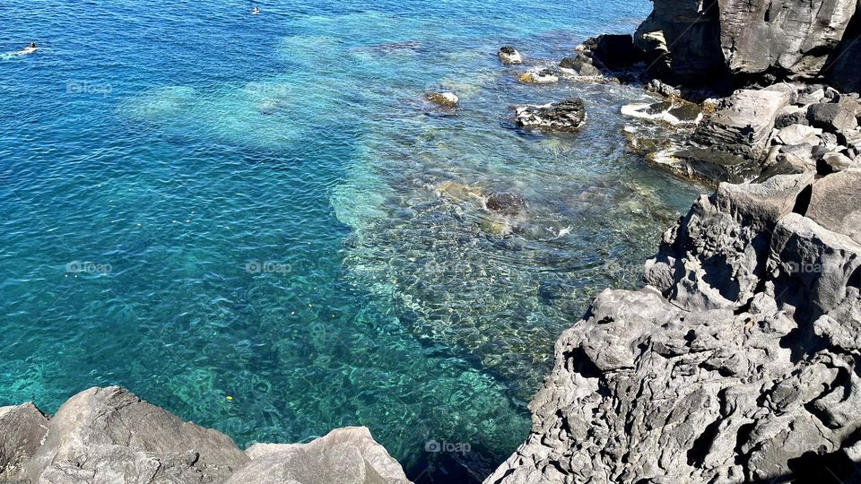 Wild and rocky landscape of the Caribbean with turquoise sea