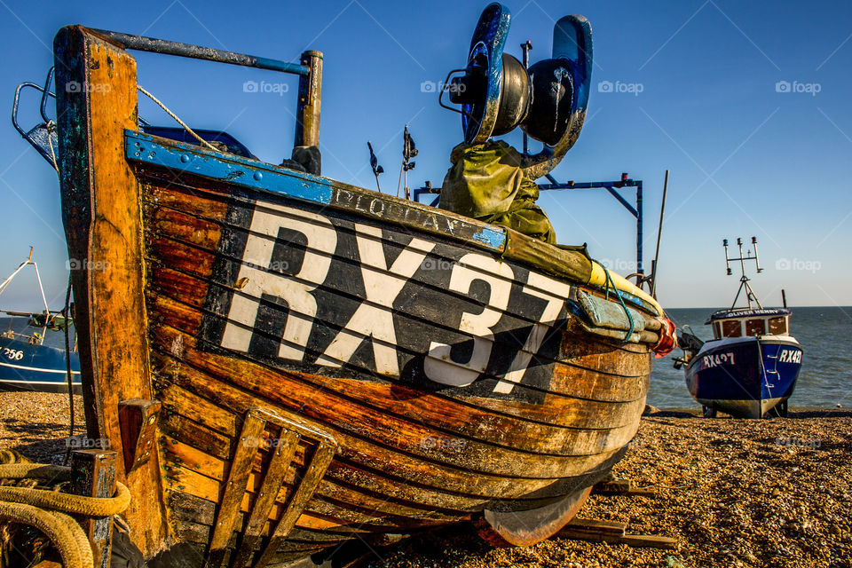 Hastings fishing boat RX37 on the pebbled beach