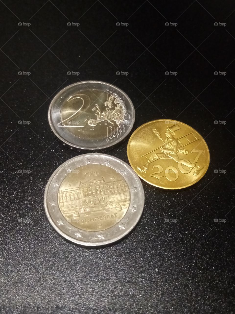 Münzen mit Glücksbringer