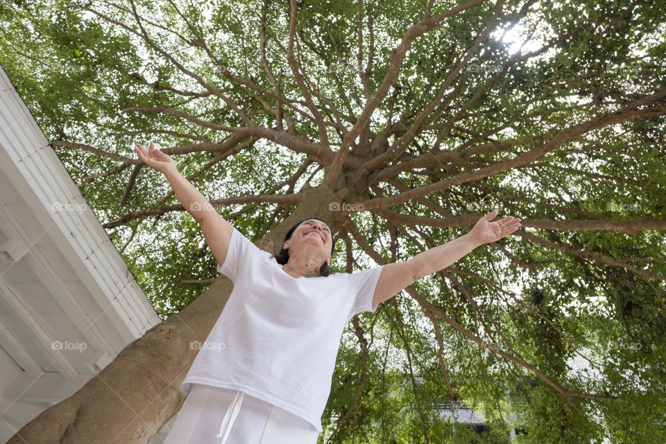 happy woman in tropical resort