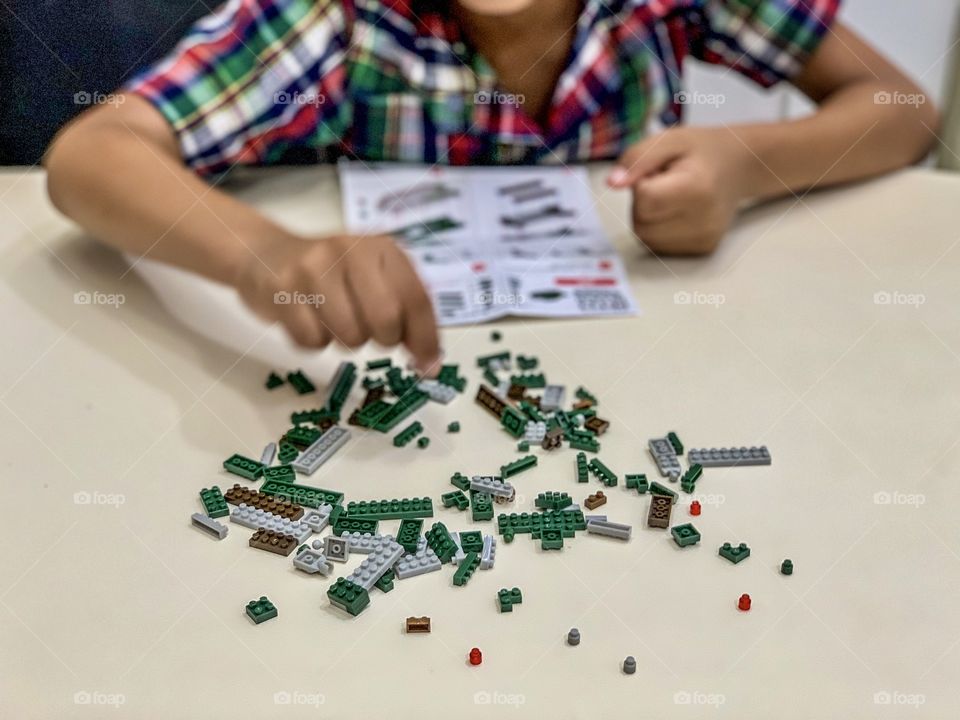 Boy playing with construction toy