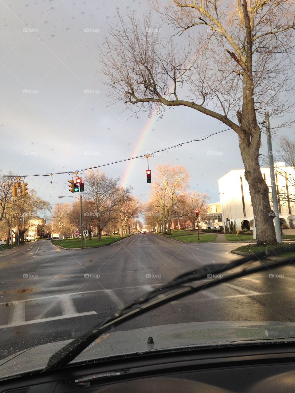 Commute to work with beautiful rainbow above 