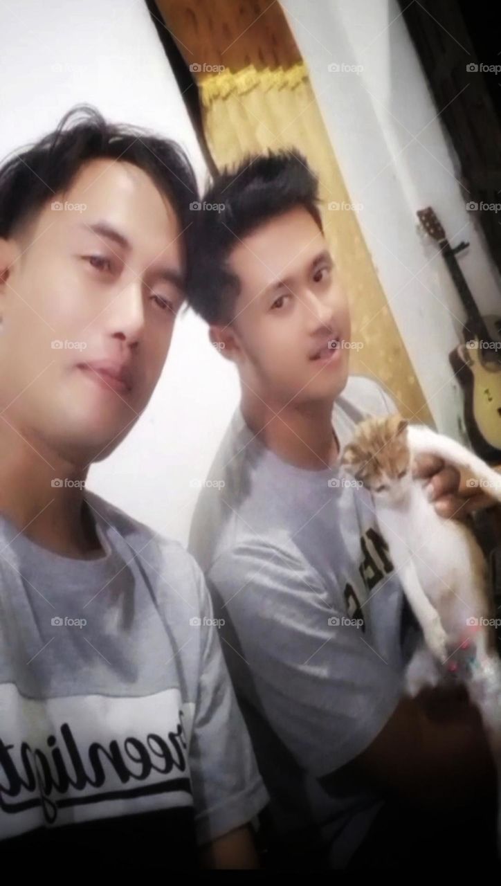 Two stylish young men at night