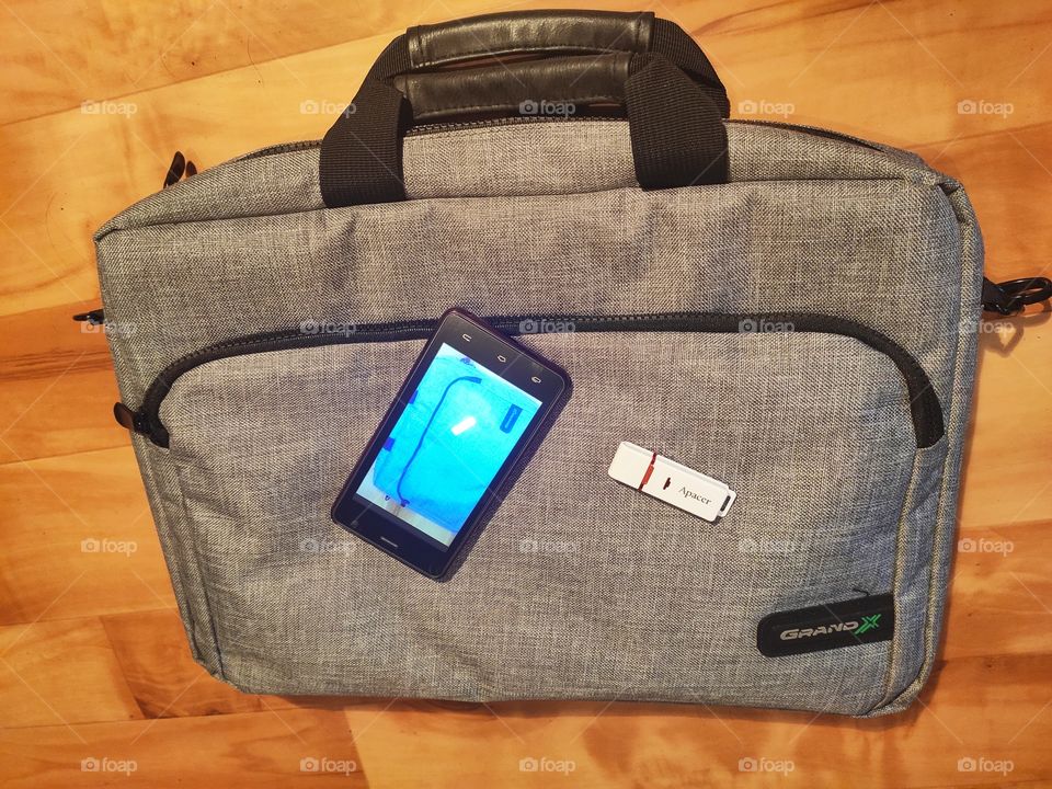 Laptop bag flash drive and phone
