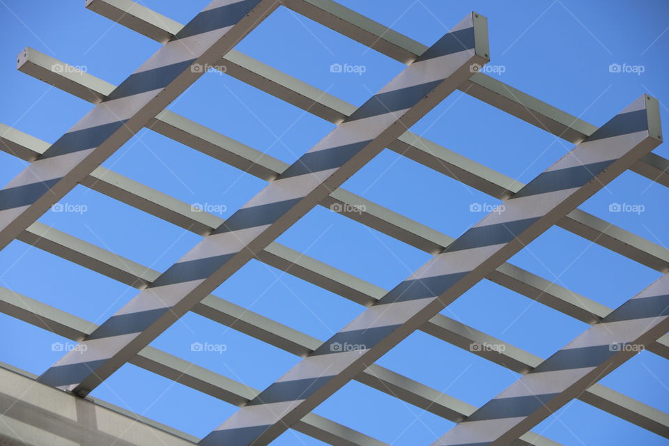 Rooftop with wooden structures with lines and its shades all the aways