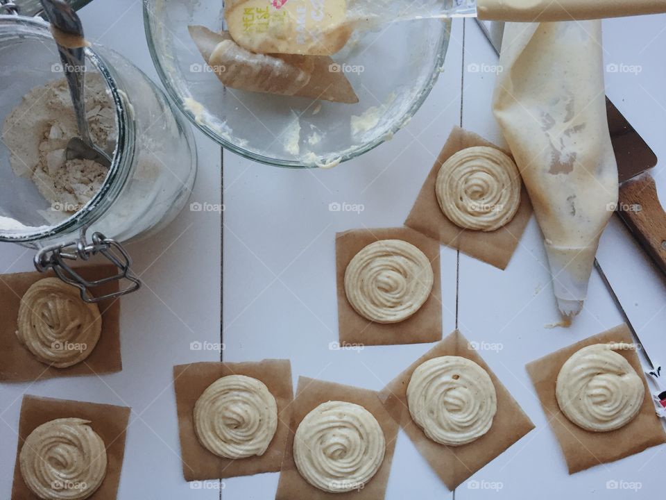 Preparing rose shaped doughnuts 