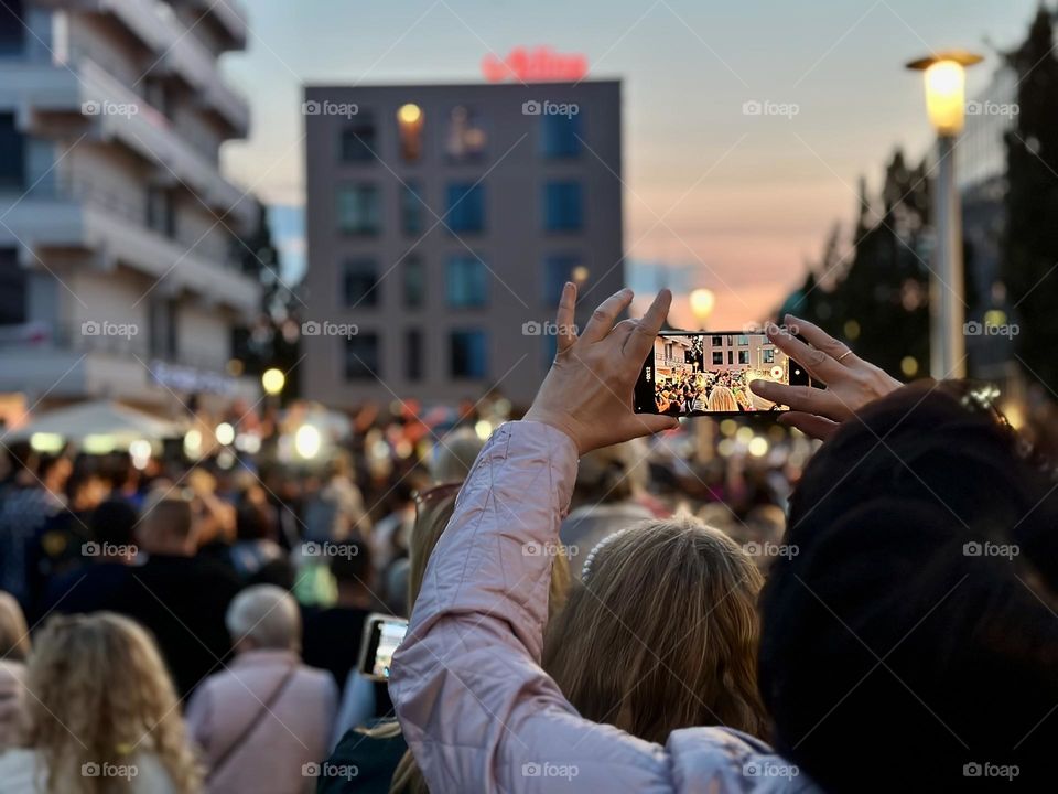 Taking a video of crowd of people 