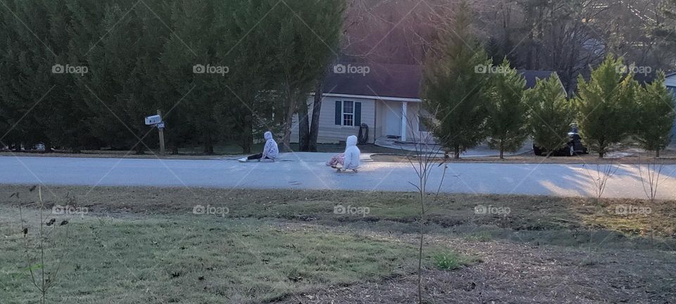 Two kids skateboarding