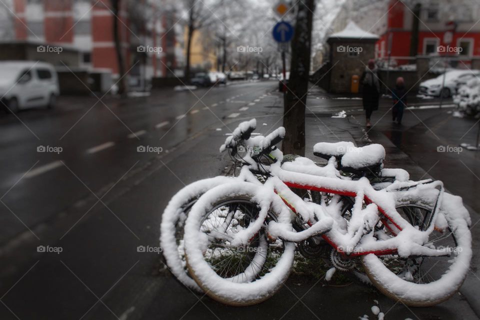 Bicycles under a snow cover in the winter.