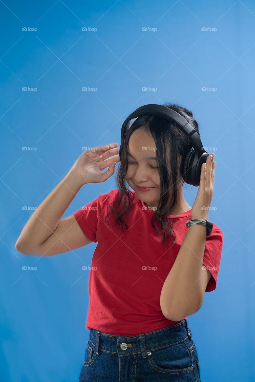 Teenage girl listening to music