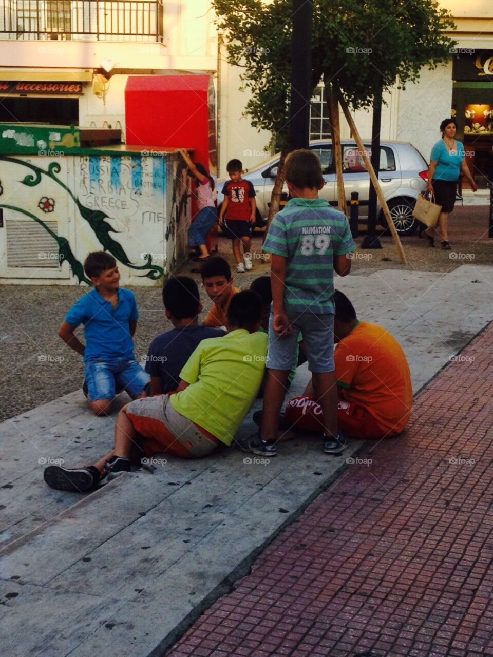 Fancynancy1982. Children playing in the square in Crete 