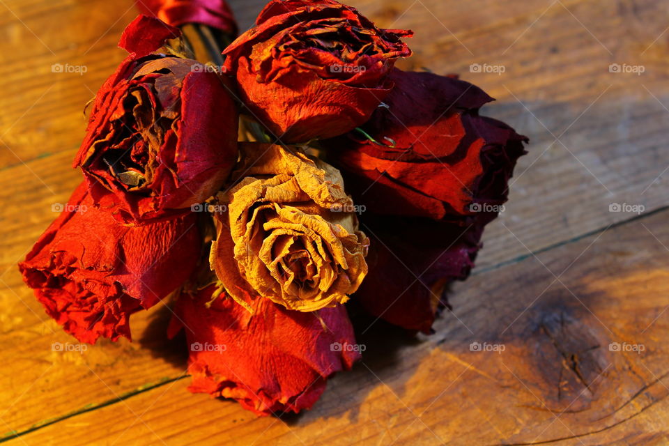 roses on wooden table