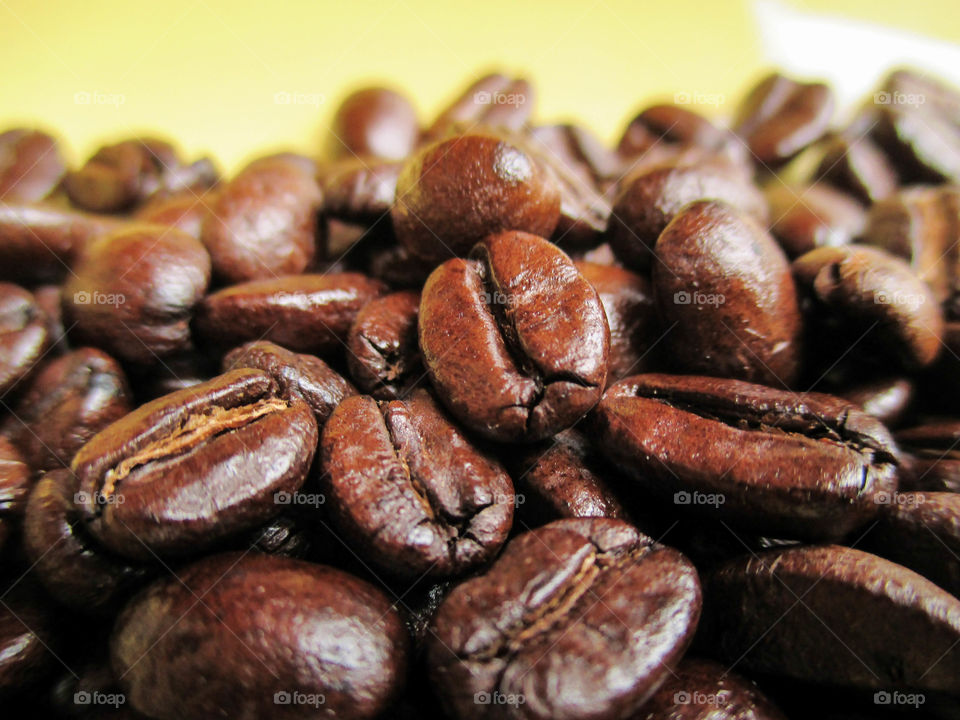 coffee beans. coffee beans on yellow background