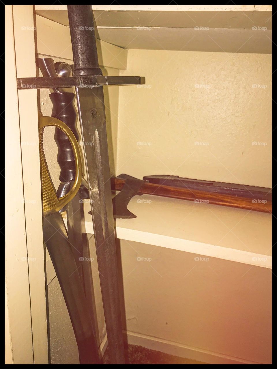 A small arsenal in the closet. This is where an assortment of bladed implements are stored safely, away from prying eyes.