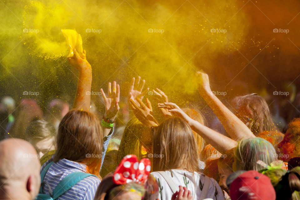 Teenagers throwing colors at the color festival