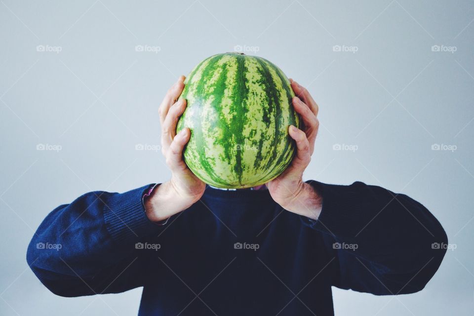 Man hand holding watermelon fruit