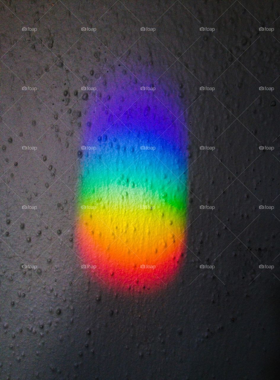 Prism on textured wall