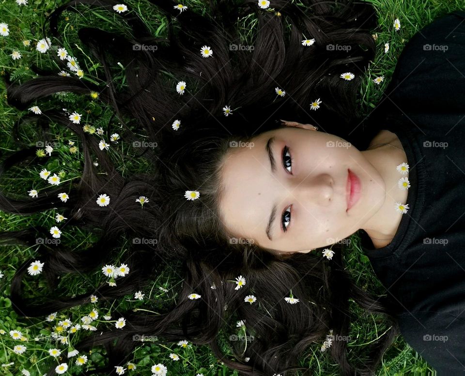 Springtime. Beautiful girl with flowers in her hair.