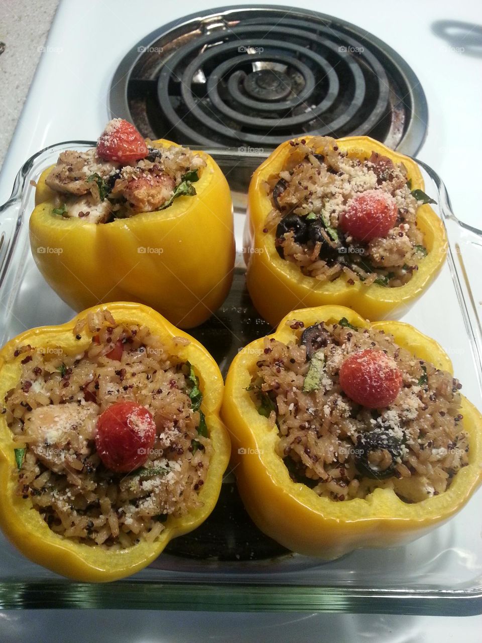 Greek style stuffed bell peppers with rice, feta, black olives and chicken