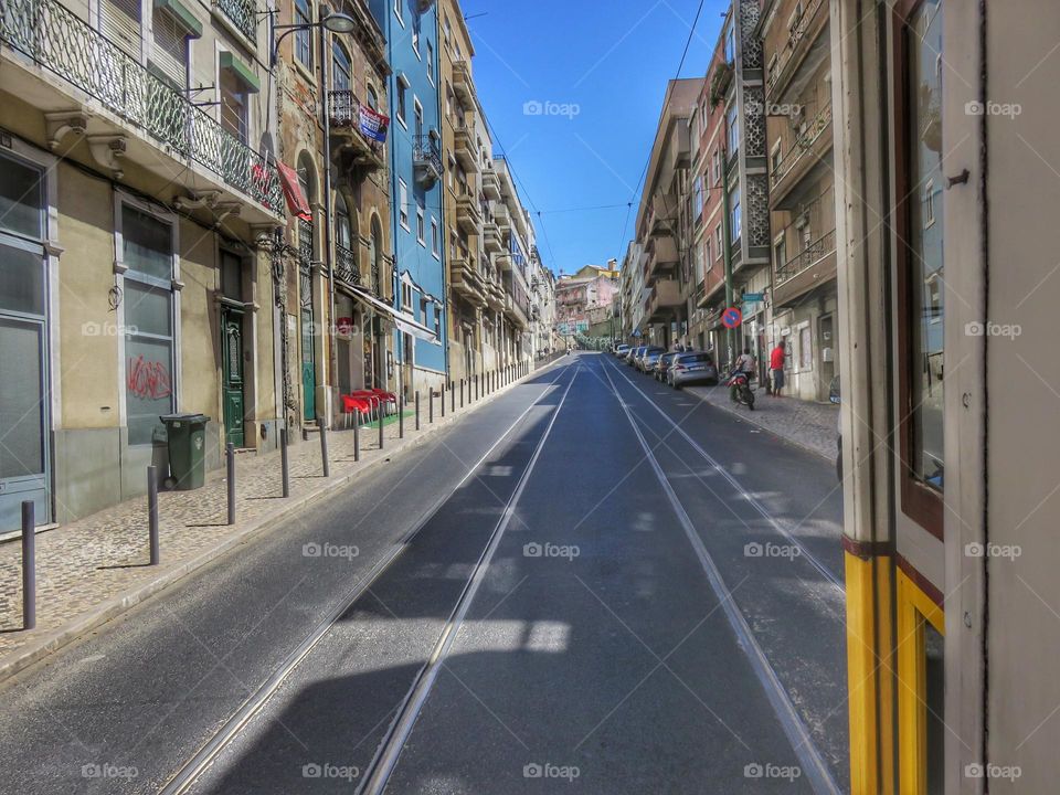 A view of a Lisbon street from a yellow tram