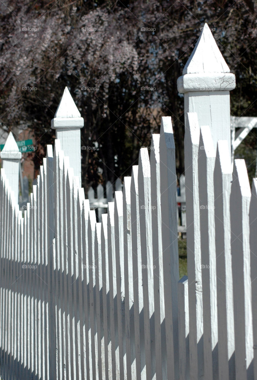 Close up black and white picket fence