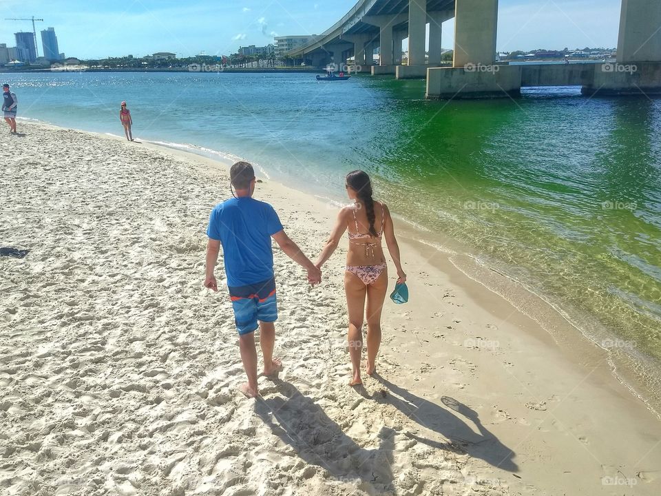 Hand-in-hand on the beach