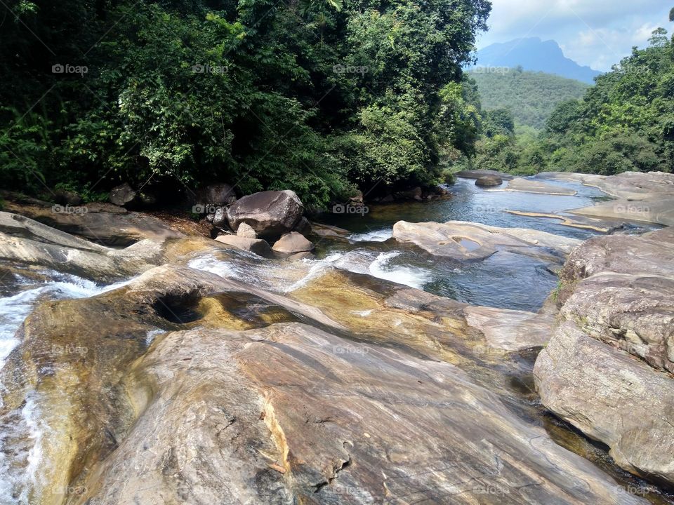 What a beautiful place. While we were hiking through the thick jungle we arrived at this beautiful location. It's a natural pond created by the water flow surrounded by a breathtaking view above the Waterfall.
